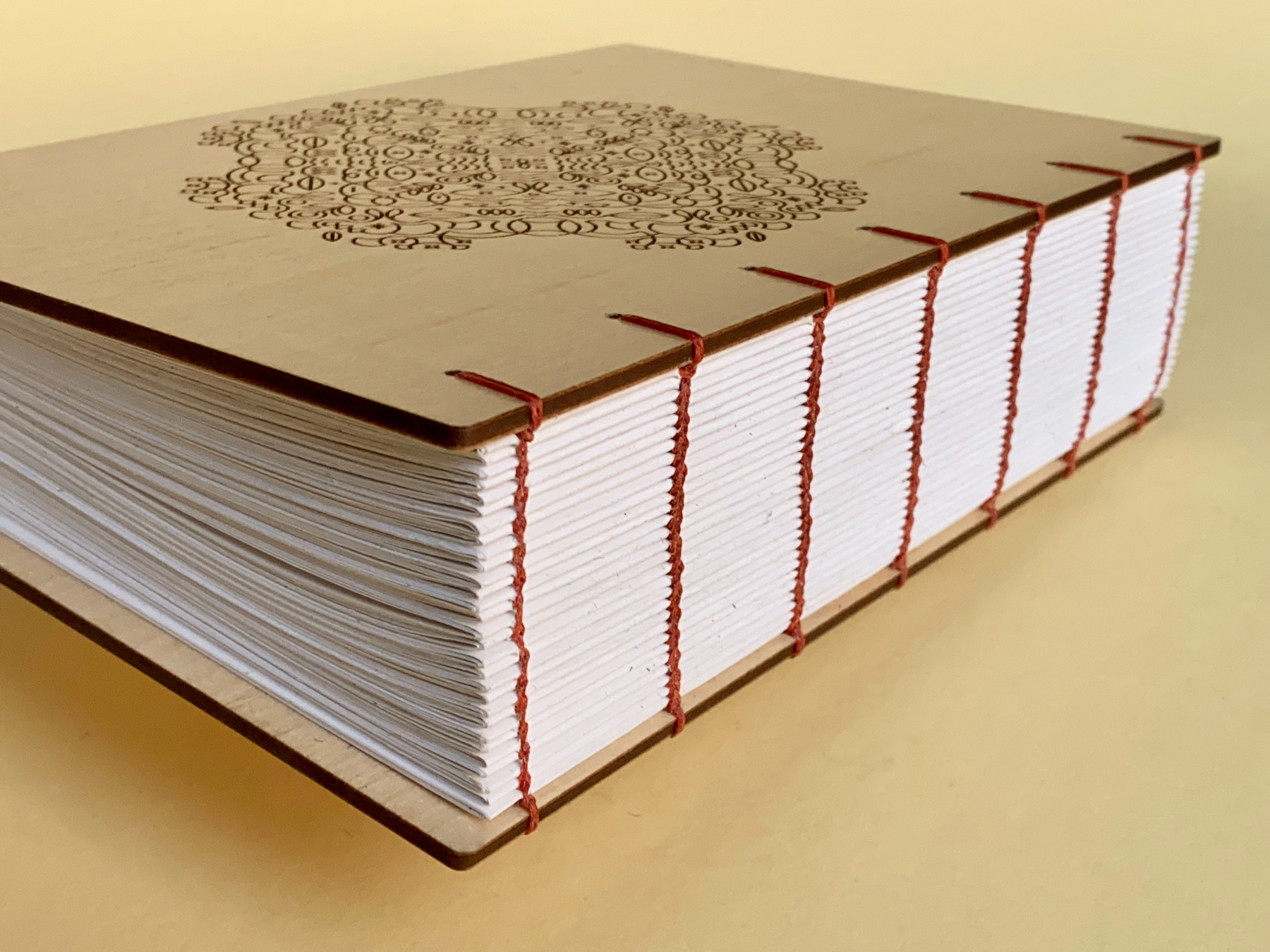 Exposed Coptic-bound spine with waxed linen thread