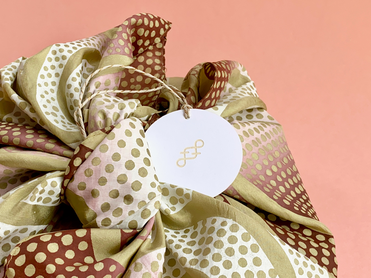 Book giftwrapped in a vintage scarf